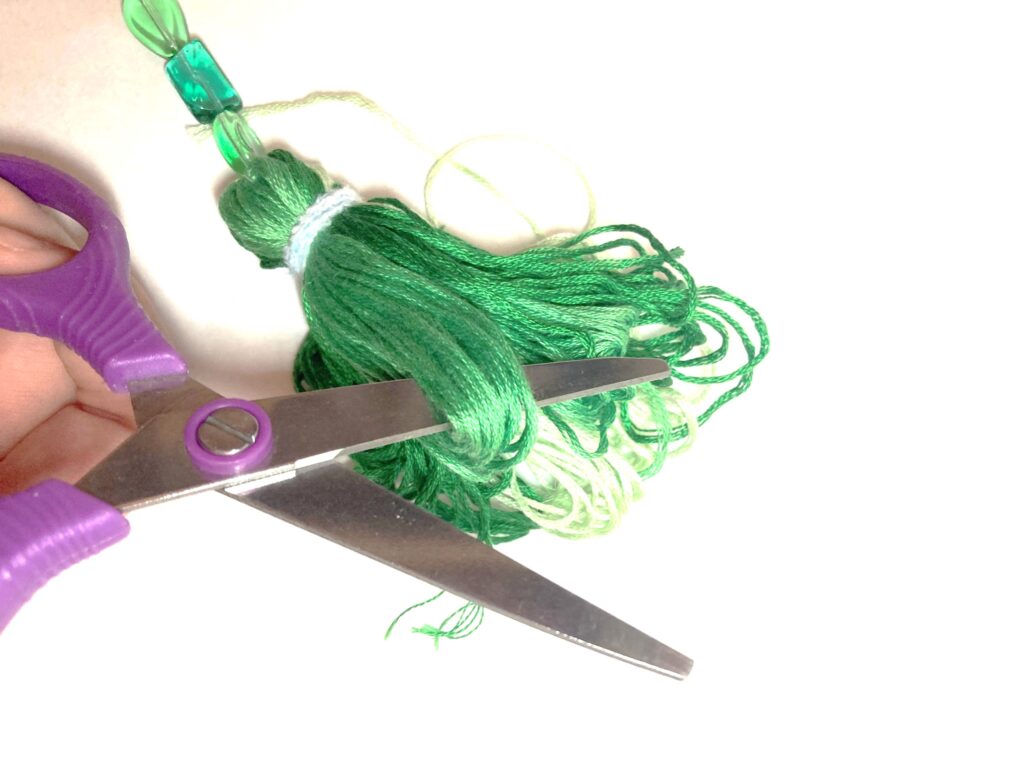 Trim tassel ends to make more "tasseley"
